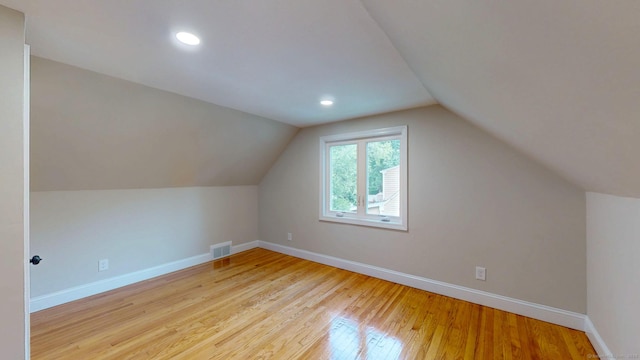 32 Miles Standish Dr, West Hartford, CT 06107 - bonus room featuring light wood-style floors, vaulted ceiling, and recessed lighting