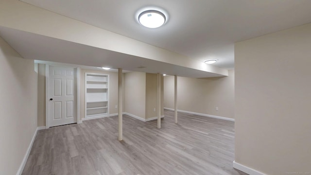 32 Miles Standish Dr, West Hartford, CT 06107 - finished below grade area with light wood-type flooring and baseboards