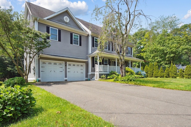 83 Cottage St, Trumbull, CT 06611 - view of front of home with a garage, covered porch, driveway, and a front yard
