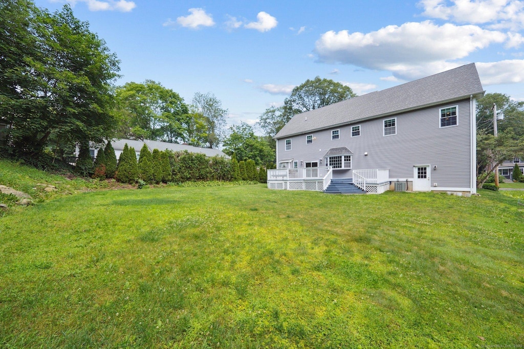 83 Cottage St, Trumbull, CT 06611 - rear view of property featuring a deck and a yard