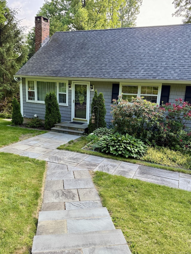 175 Luna Trail Ext, Southbury, CT 06488 - view of front of property with a shingled roof, a chimney, and a front lawn