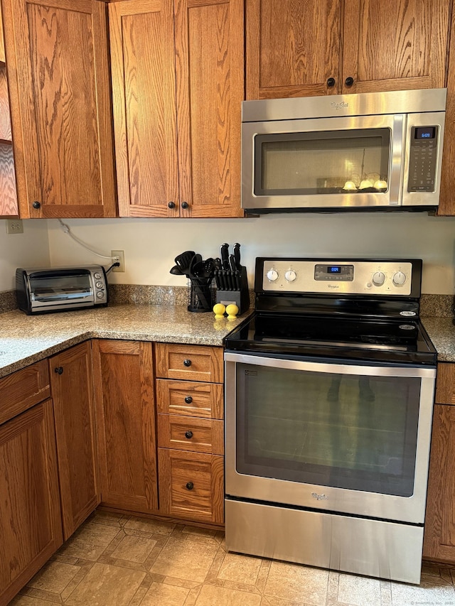 175 Luna Trail Ext, Southbury, CT 06488 - kitchen featuring appliances with stainless steel finishes and brown cabinets