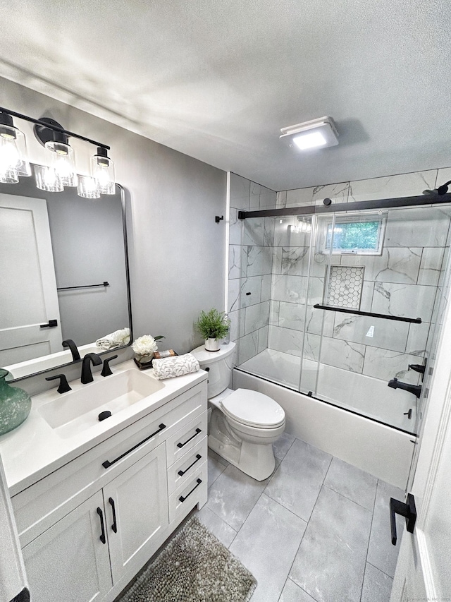 342 Middle Tpke E, Manchester, CT 06040 - full bathroom with vanity, a textured ceiling, and bath / shower combo with glass door