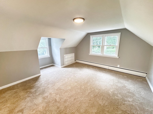 342 Middle Tpke E, Manchester, CT 06040 - additional living space with a baseboard heating unit, carpet, plenty of natural light, and lofted ceiling