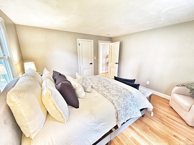 342 Middle Tpke E, Manchester, CT 06040 - bedroom featuring baseboards and light wood finished floors