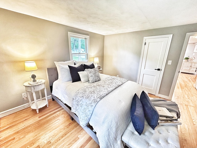 342 Middle Tpke E, Manchester, CT 06040 - bedroom with light wood-type flooring and baseboards