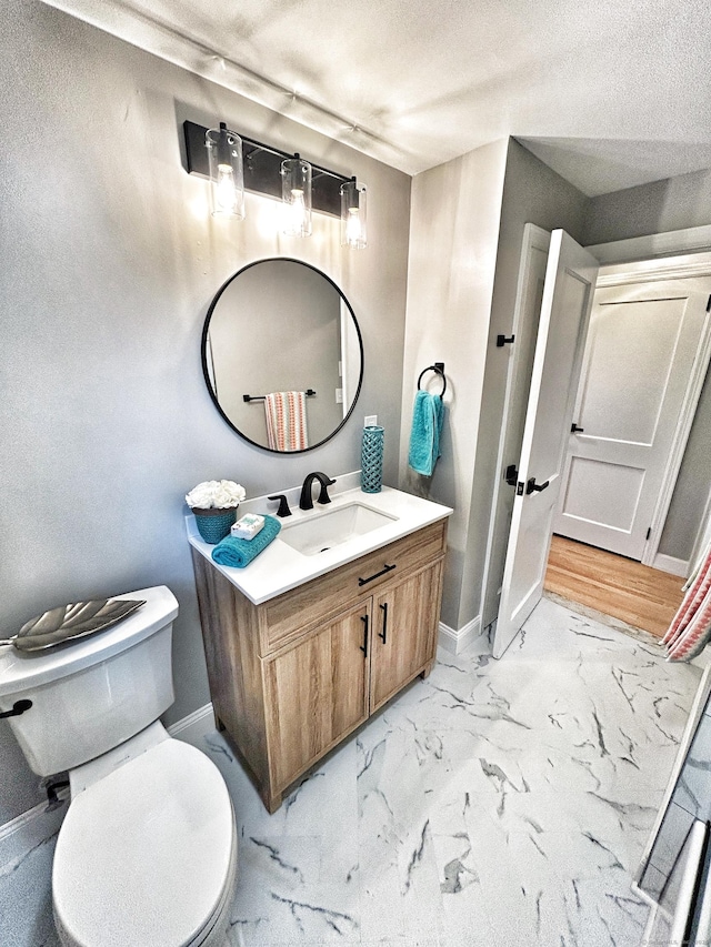 342 Middle Tpke E, Manchester, CT 06040 - bathroom with vanity, marble look tiles, and a textured ceiling