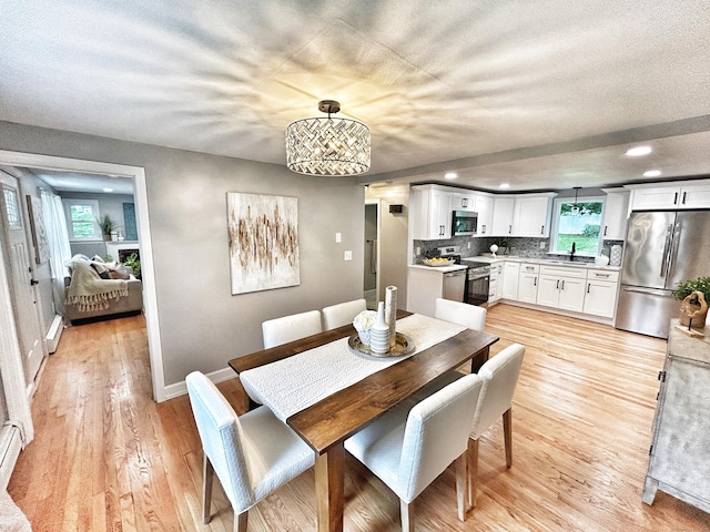 342 Middle Tpke E, Manchester, CT 06040 - dining room featuring light wood-type flooring, recessed lighting, and a chandelier