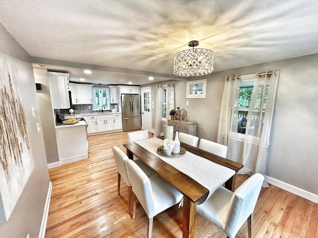 342 Middle Tpke E, Manchester, CT 06040 - dining area with light wood-style floors and recessed lighting