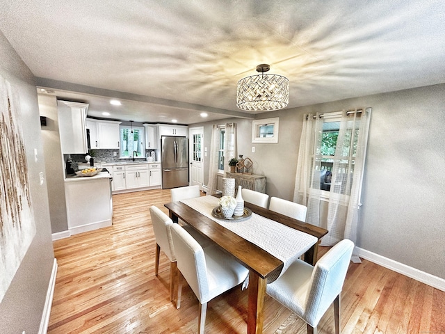 342 Middle Tpke E, Manchester, CT 06040 - dining space featuring light wood finished floors, recessed lighting, a chandelier, a textured wall, and a textured ceiling