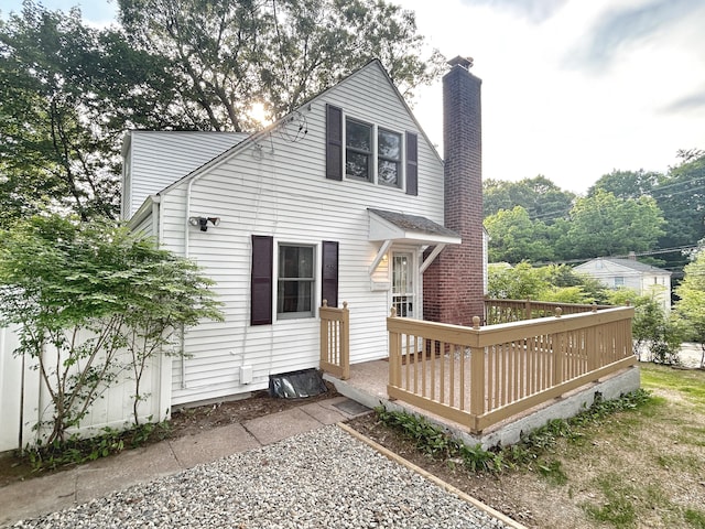342 Middle Tpke E, Manchester, CT 06040 - rear view of property with a chimney and a wooden deck