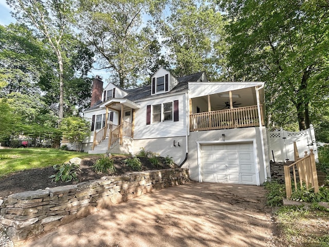342 Middle Tpke E, Manchester, CT 06040 - cape cod-style house featuring a ceiling fan, a garage, driveway, and a chimney