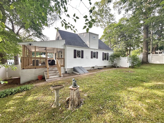 342 Middle Tpke E, Manchester, CT 06040 - rear view of property with a fenced backyard, a shingled roof, and ceiling fan