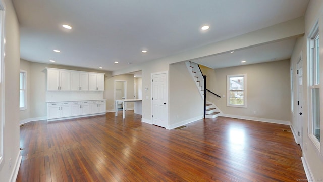 274 High St, Fairfield, CT 06824 - unfurnished living room with dark wood finished floors, stairs, and recessed lighting