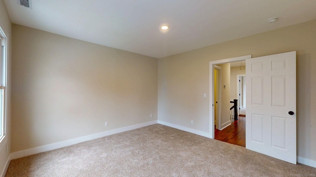 274 High St, Fairfield, CT 06824 - empty room with dark colored carpet, a smoke detector, and recessed lighting