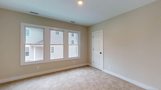 274 High St, Fairfield, CT 06824 - unfurnished room with light carpet and baseboards