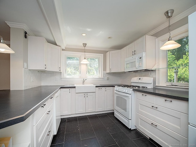42 Homewood Ave, North Haven, CT 06473 - kitchen featuring white appliances, dark countertops, plenty of natural light, crown molding, and white cabinets
