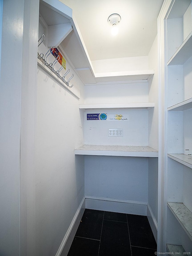 42 Homewood Ave, North Haven, CT 06473 - walk in closet with dark tile patterned floors