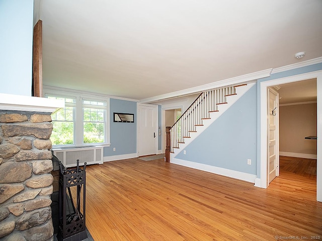 42 Homewood Ave, North Haven, CT 06473 - unfurnished living room featuring crown molding, stairs, and light wood-type flooring