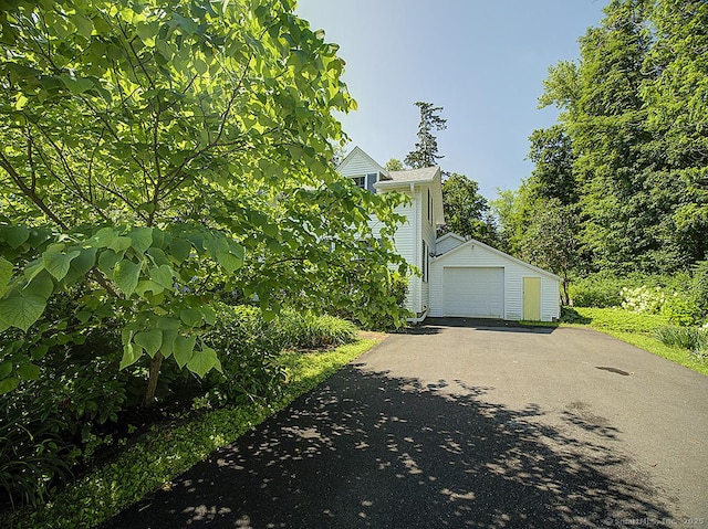 42 Homewood Ave, North Haven, CT 06473 - view of side of home featuring driveway and a detached garage