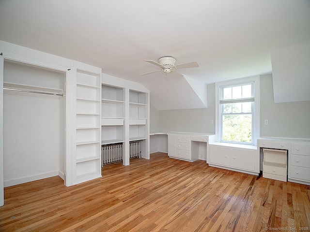 42 Homewood Ave, North Haven, CT 06473 - unfurnished bedroom with light wood-style flooring, built in desk, vaulted ceiling, and ceiling fan