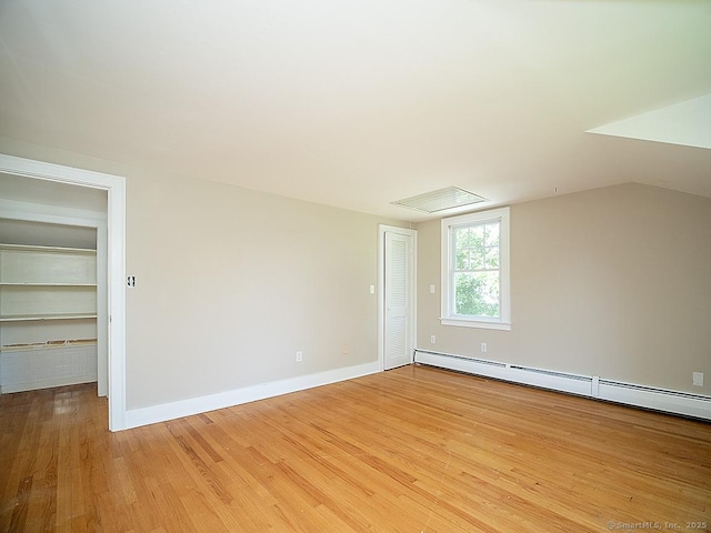 42 Homewood Ave, North Haven, CT 06473 - spare room with light wood finished floors, a baseboard radiator, and vaulted ceiling