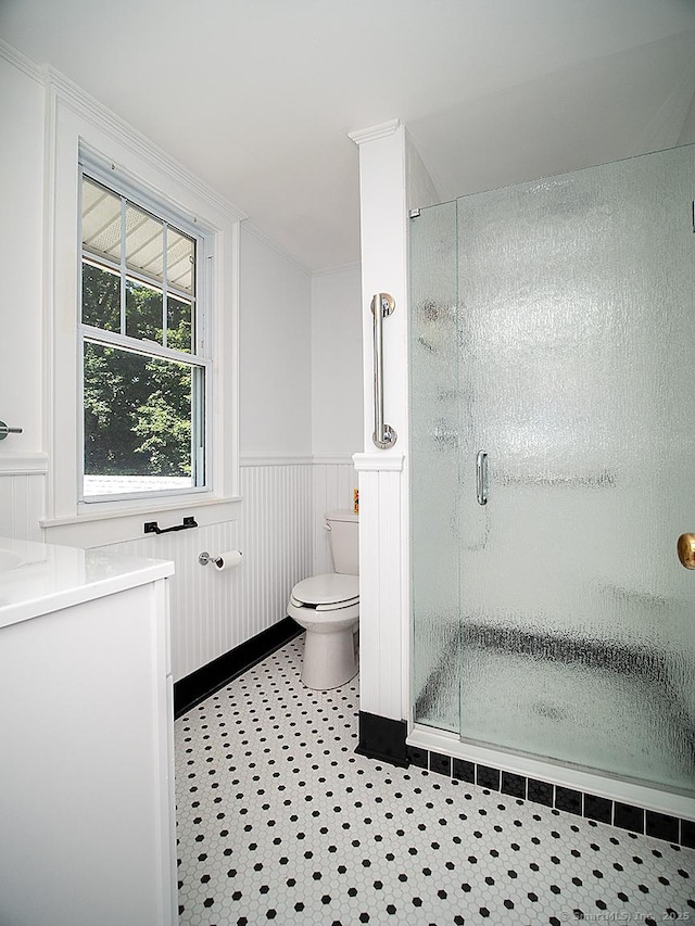 42 Homewood Ave, North Haven, CT 06473 - bathroom featuring a stall shower and a wainscoted wall