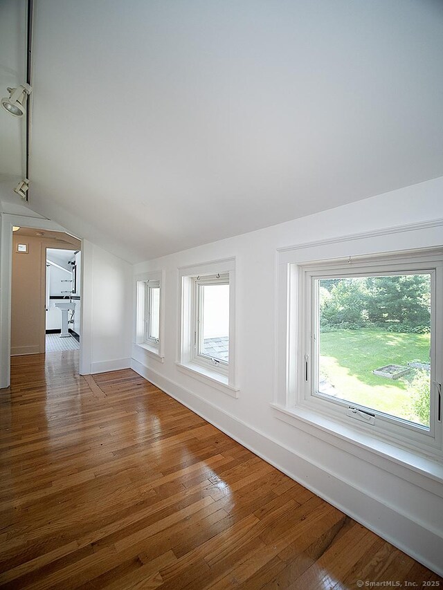 42 Homewood Ave, North Haven, CT 06473 - spare room with lofted ceiling and hardwood / wood-style flooring