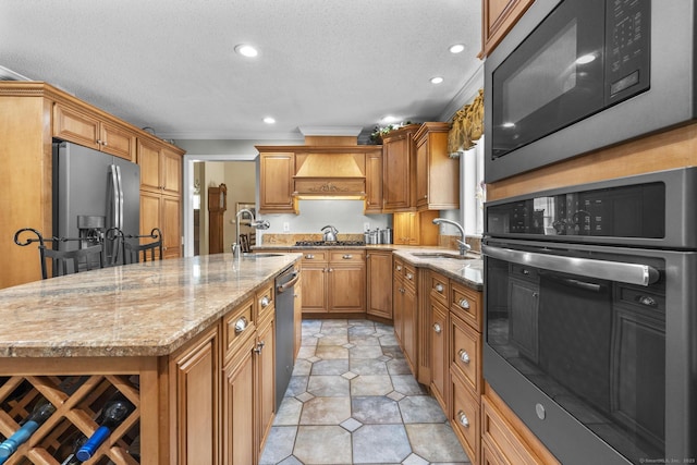 1199 Cornerstone Ct, Cheshire, CT 06410 - kitchen featuring stainless steel appliances, light stone countertops, a kitchen island with sink, recessed lighting, and a textured ceiling