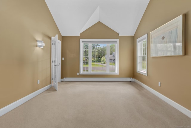 1199 Cornerstone Ct, Cheshire, CT 06410 - empty room featuring a baseboard radiator, carpet flooring, and vaulted ceiling