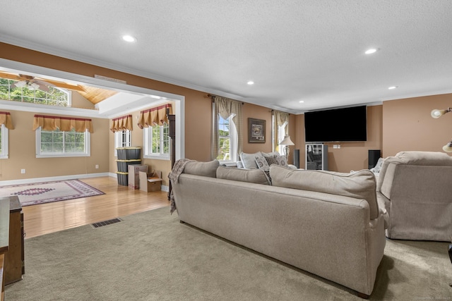 1199 Cornerstone Ct, Cheshire, CT 06410 - carpeted living area with crown molding, recessed lighting, a textured ceiling, and wood finished floors