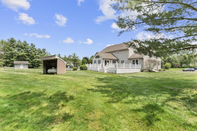 1199 Cornerstone Ct, Cheshire, CT 06410 - rear view of property with a storage unit, a yard, and a wooden deck