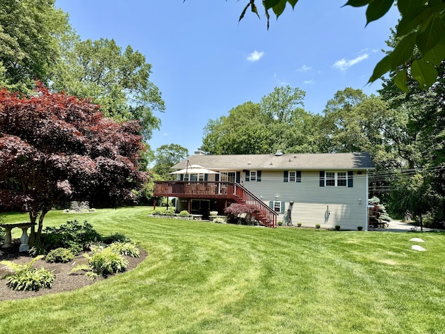 44 Fawn Hill Rd, Shelton, CT 06484 - back of property featuring a wooden deck, stairs, and a lawn