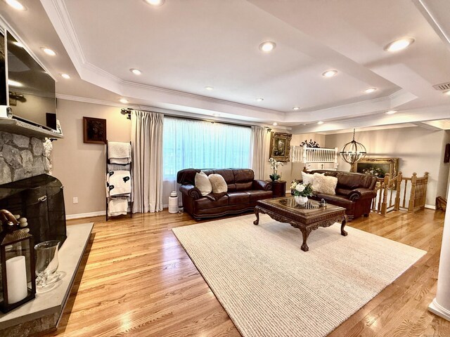 44 Fawn Hill Rd, Shelton, CT 06484 - living area featuring a tray ceiling, ornamental molding, light wood-style flooring, a fireplace, and recessed lighting