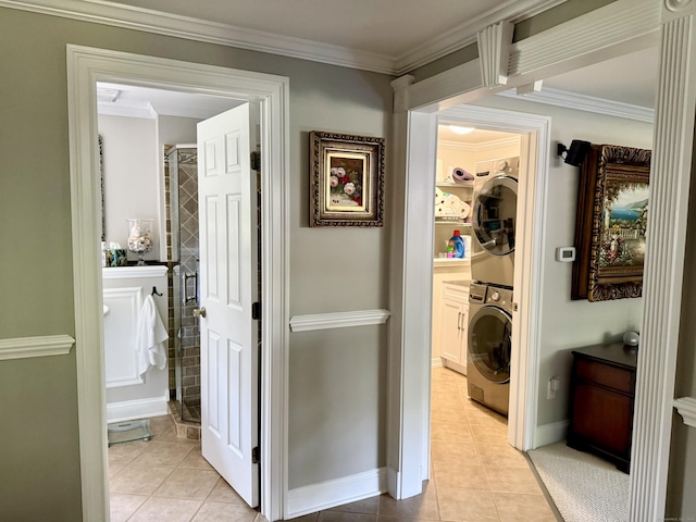 44 Fawn Hill Rd, Shelton, CT 06484 - corridor featuring stacked washer / dryer, light tile patterned floors, and ornamental molding