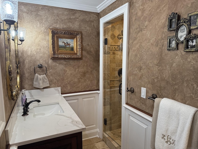 44 Fawn Hill Rd, Shelton, CT 06484 - full bathroom featuring vanity, a stall shower, crown molding, a decorative wall, and wainscoting
