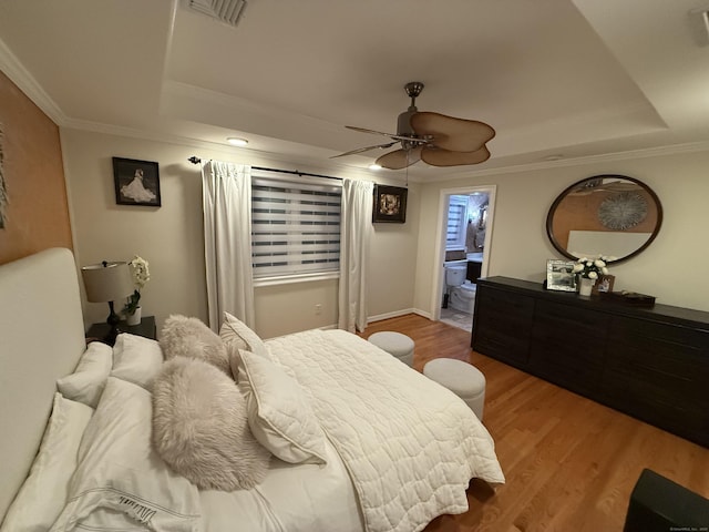 44 Fawn Hill Rd, Shelton, CT 06484 - bedroom featuring a raised ceiling, ornamental molding, wood finished floors, a ceiling fan, and connected bathroom