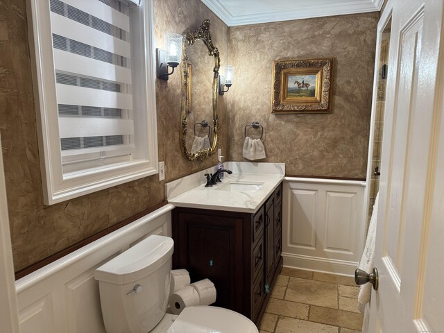 44 Fawn Hill Rd, Shelton, CT 06484 - bathroom featuring a decorative wall, stone tile flooring, ornamental molding, vanity, and wainscoting