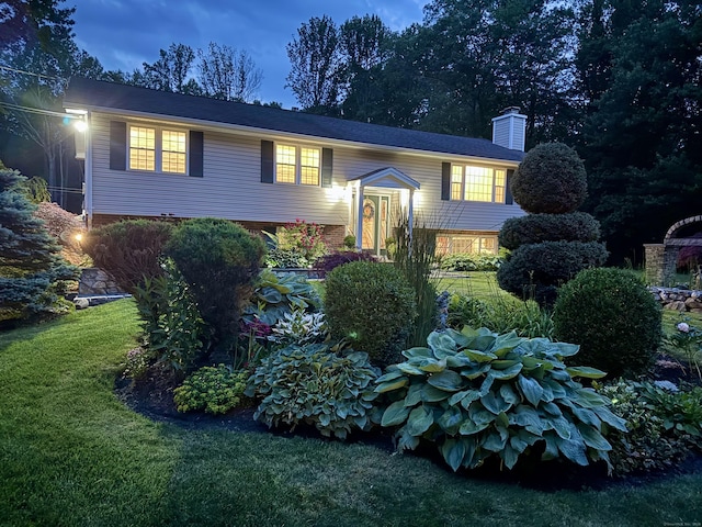44 Fawn Hill Rd, Shelton, CT 06484 - view of front of home with a front lawn and a chimney