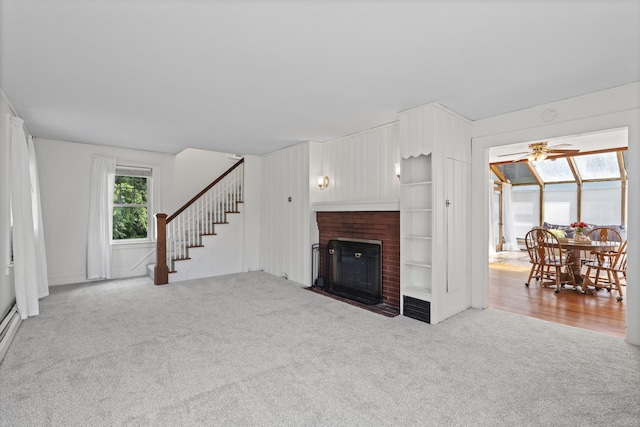 136 Bloomfield Ave, Windsor, CT 06095 - living area with carpet flooring, a fireplace, stairs, and ceiling fan