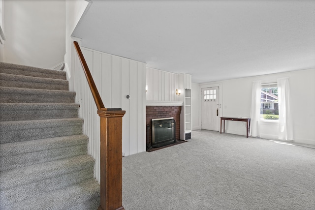 136 Bloomfield Ave, Windsor, CT 06095 - unfurnished living room with stairway, carpet, and a fireplace