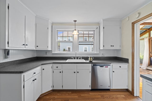 136 Bloomfield Ave, Windsor, CT 06095 - kitchen with dishwasher, dark countertops, dark wood finished floors, white cabinetry, and ornamental molding