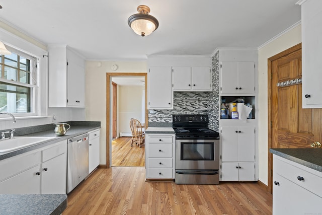 136 Bloomfield Ave, Windsor, CT 06095 - kitchen featuring appliances with stainless steel finishes, light wood-style flooring, tasteful backsplash, white cabinetry, and ornamental molding