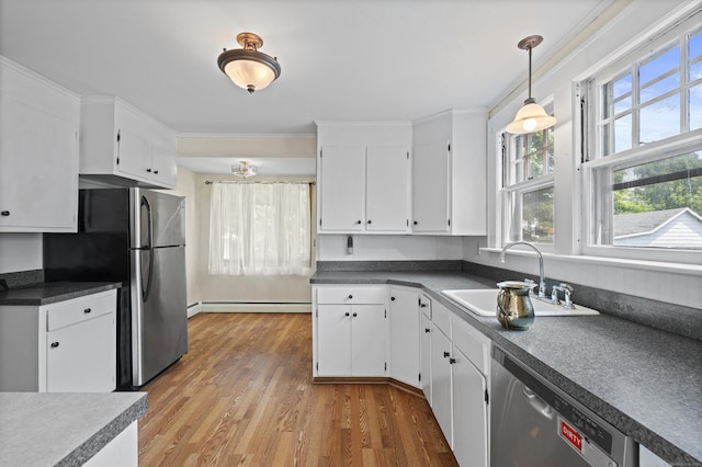 136 Bloomfield Ave, Windsor, CT 06095 - kitchen with appliances with stainless steel finishes, light wood-style floors, white cabinets, baseboard heating, and hanging light fixtures