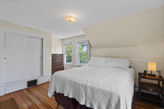 136 Bloomfield Ave, Windsor, CT 06095 - bedroom with wood finished floors, vaulted ceiling, and a closet