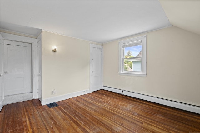 136 Bloomfield Ave, Windsor, CT 06095 - unfurnished bedroom featuring a baseboard radiator, wood finished floors, and lofted ceiling