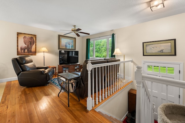 65 Norwich Westerly Rd, North Stonington, CT 06359 - living area featuring hardwood / wood-style floors and a ceiling fan