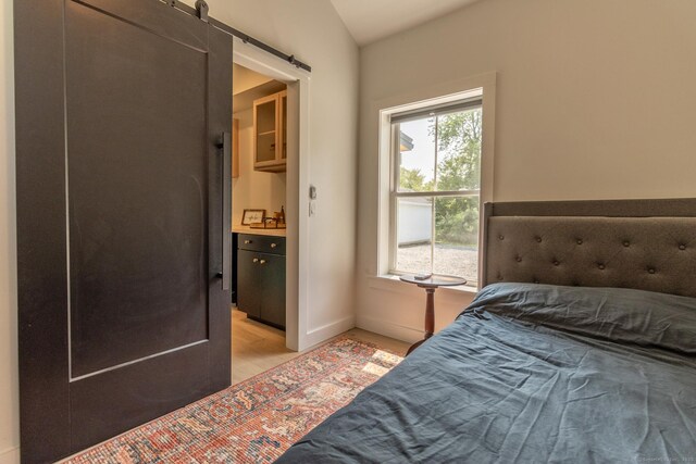 376 Rte 165, Preston, CT 06365 - bedroom with light wood-type flooring and a barn door