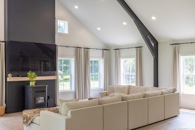 376 Rte 165, Preston, CT 06365 - living room with a wood stove, wood finished floors, vaulted ceiling, and recessed lighting