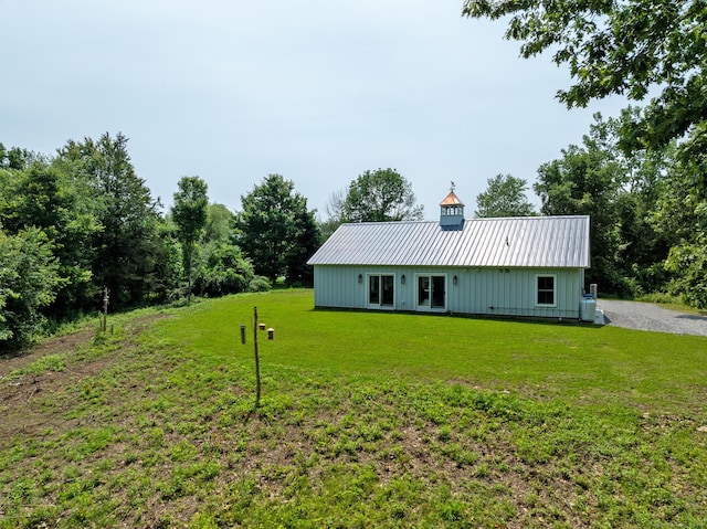 376 Rte 165, Preston, CT 06365 - rear view of property featuring a metal roof, a yard, and board and batten siding